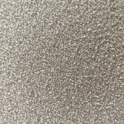 A close-up texture shot of a dense, short-pile loop pile carpet in a light beige or off-white color.